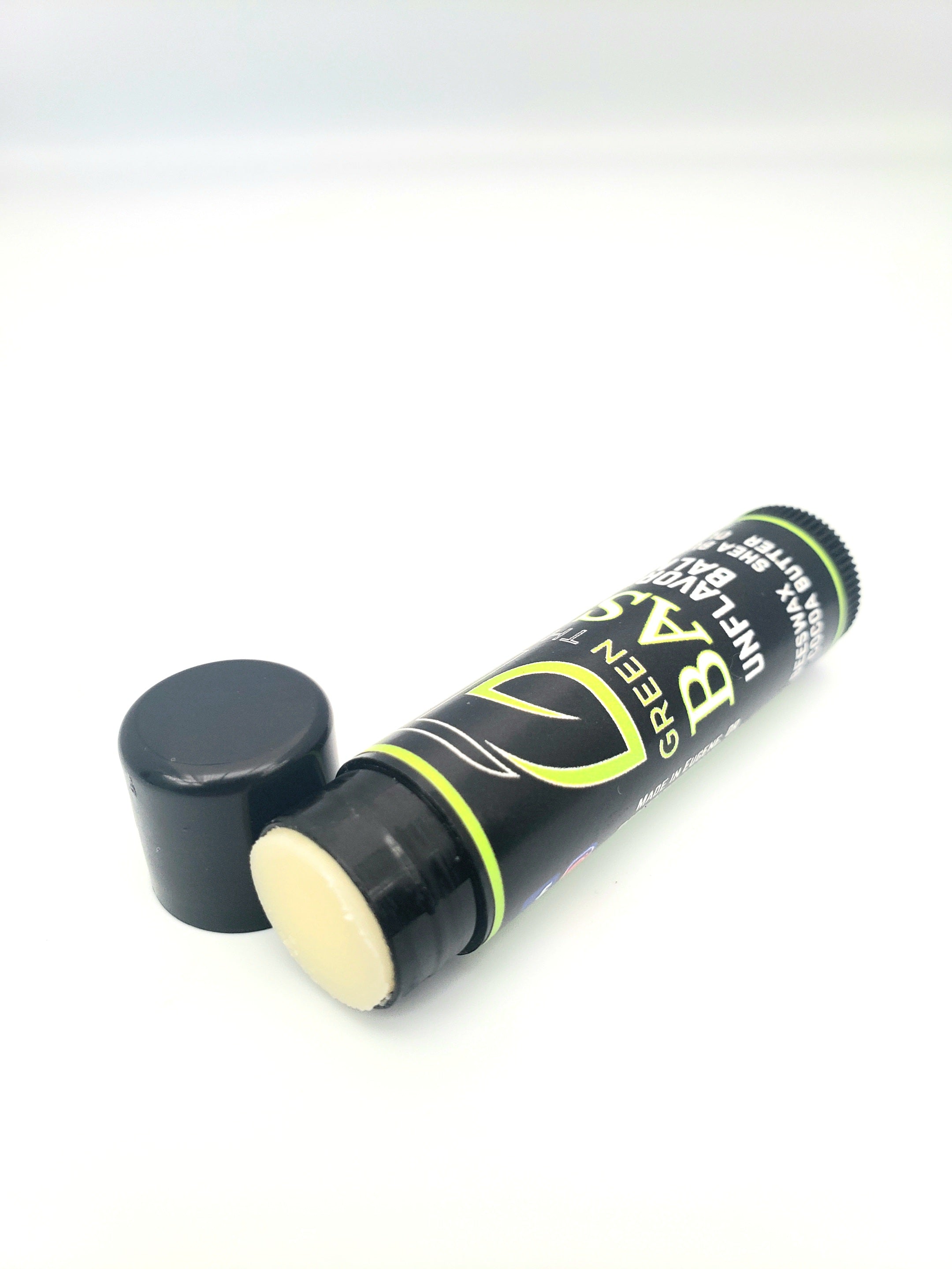 Green Theory Basic Unflavored All Natural Lip Balm in a sleek tube, showcasing its natural ingredients and eco-friendly packaging.