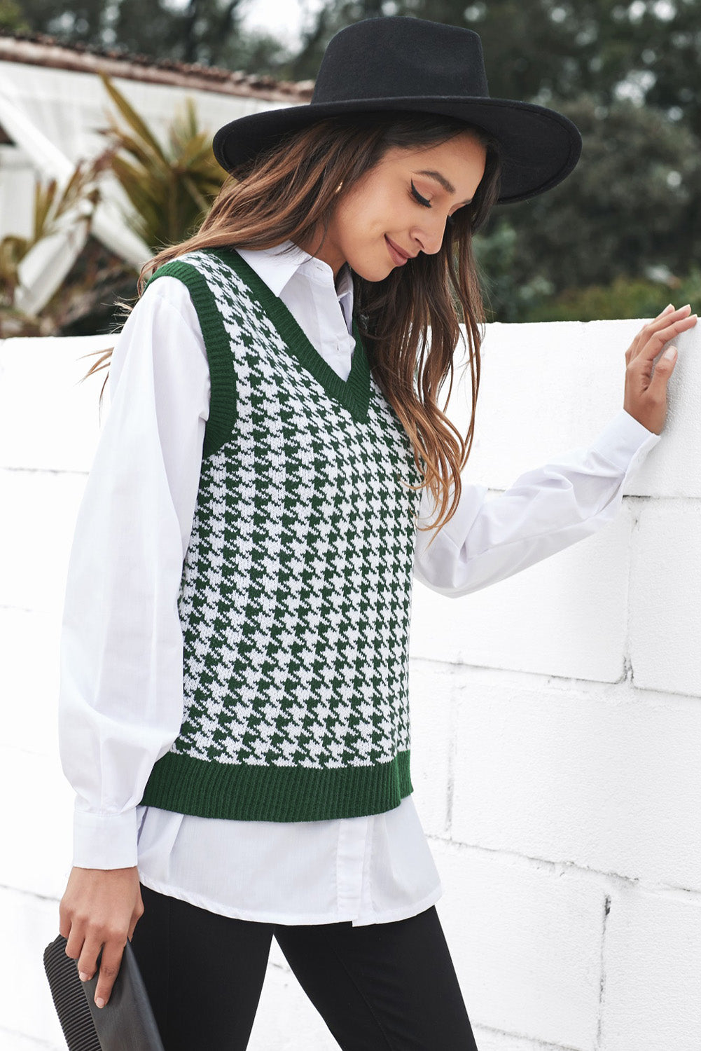 A stylish green V neck argyle plaid knitted sweater vest, showcasing a classic pattern and soft texture, perfect for layering.