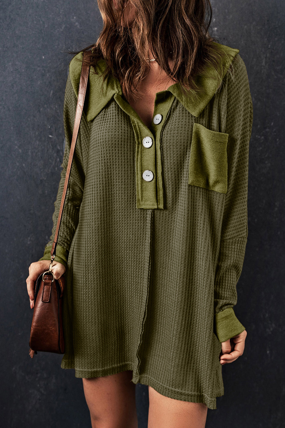 A stylish green waffle knit long sleeve top with buttons, perfect for casual wear and layering.