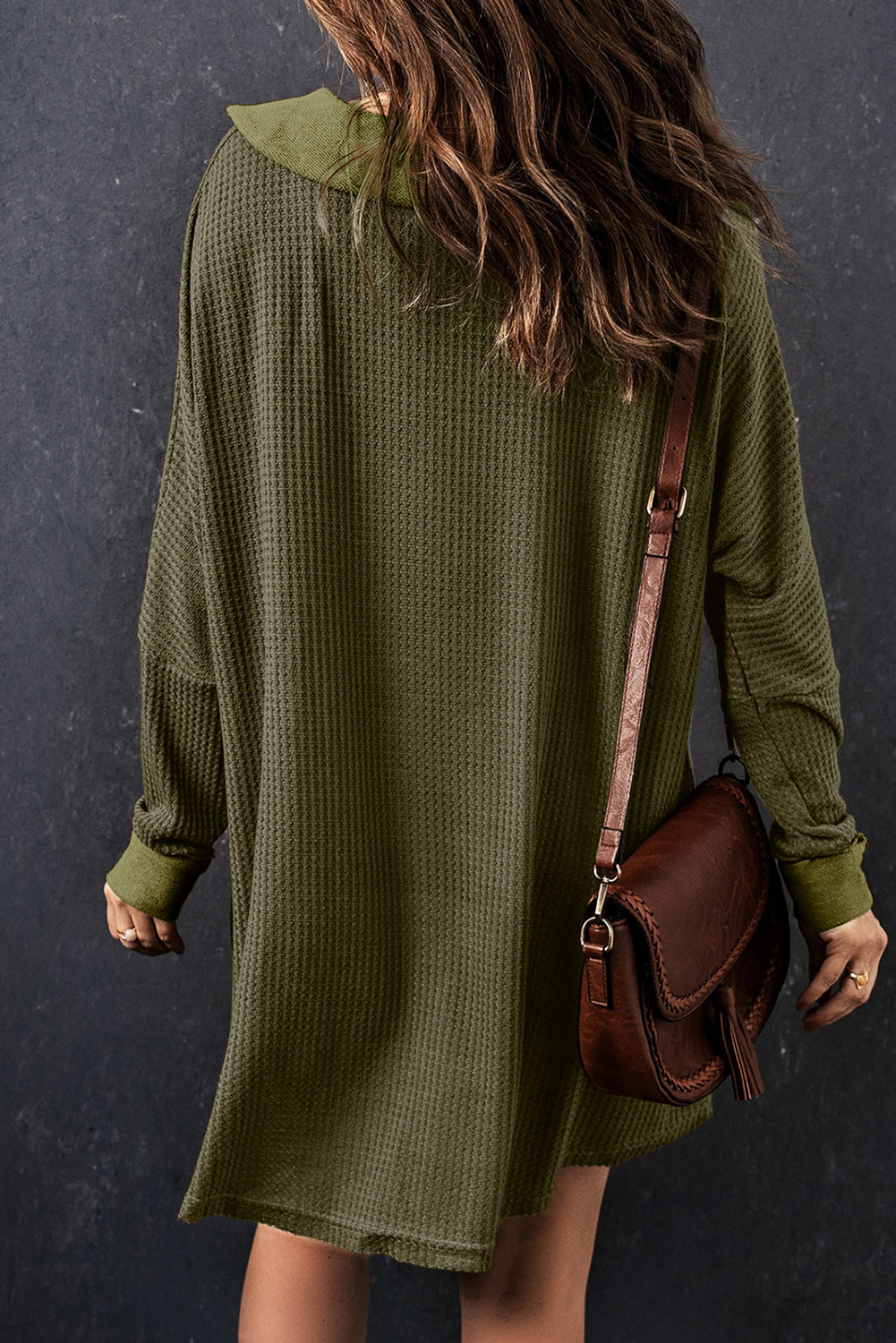 A stylish green waffle knit long sleeve top with buttons, perfect for casual wear and layering.