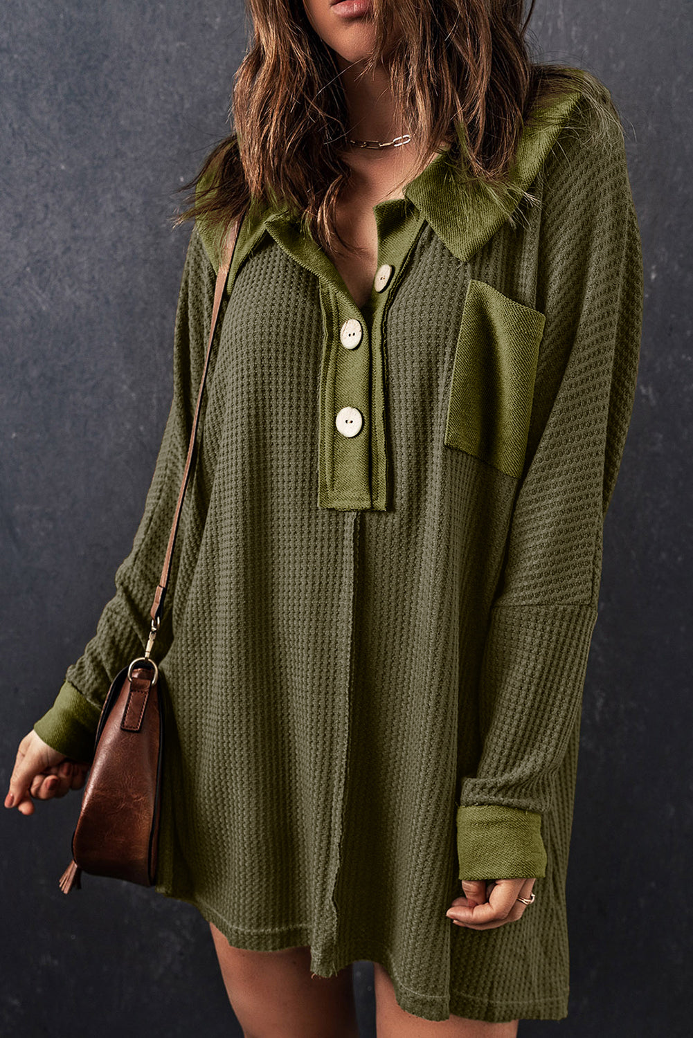 A stylish green waffle knit long sleeve top with buttons, perfect for casual wear and layering.