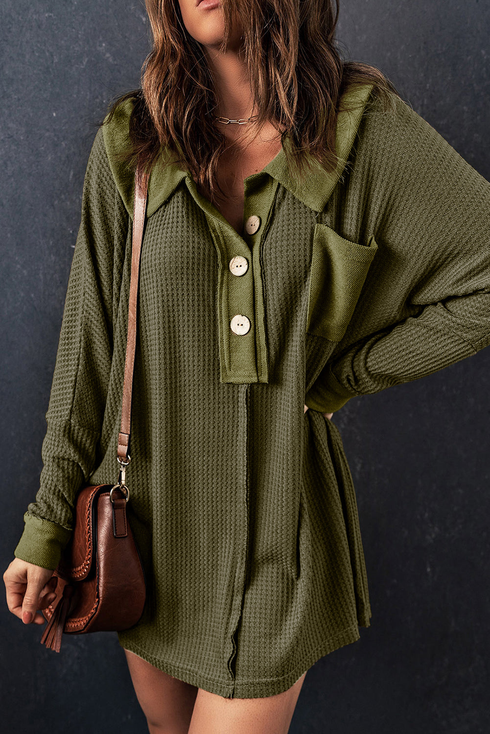 A stylish green waffle knit long sleeve top with buttons, perfect for casual wear and layering.