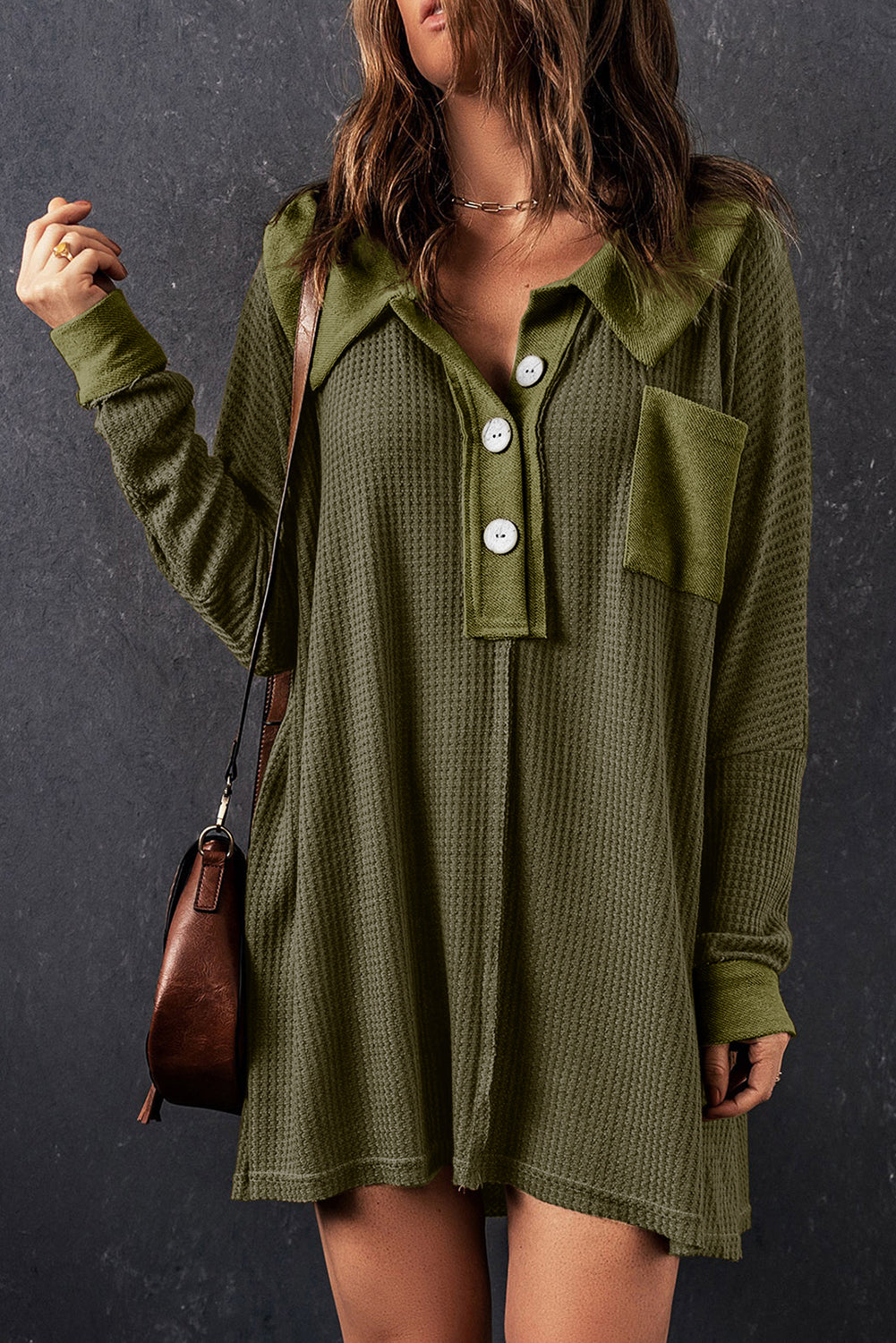 A stylish green waffle knit long sleeve top with buttons, perfect for casual wear and layering.