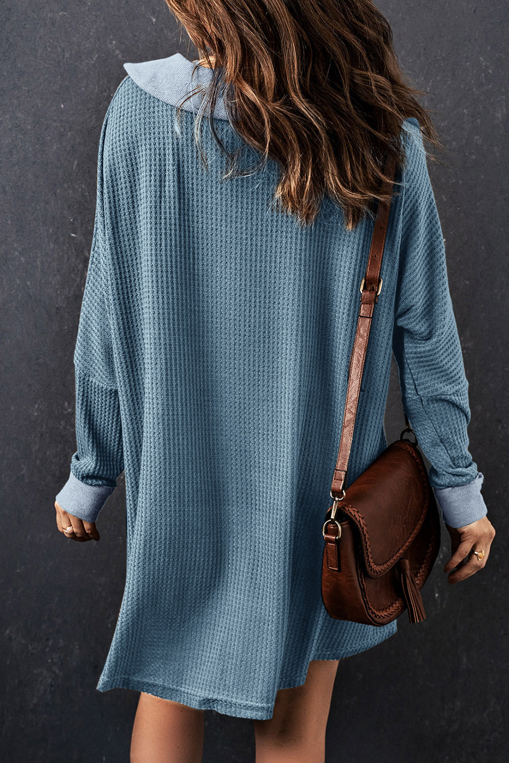 A stylish green waffle knit long sleeve top with buttons, perfect for casual wear and layering.