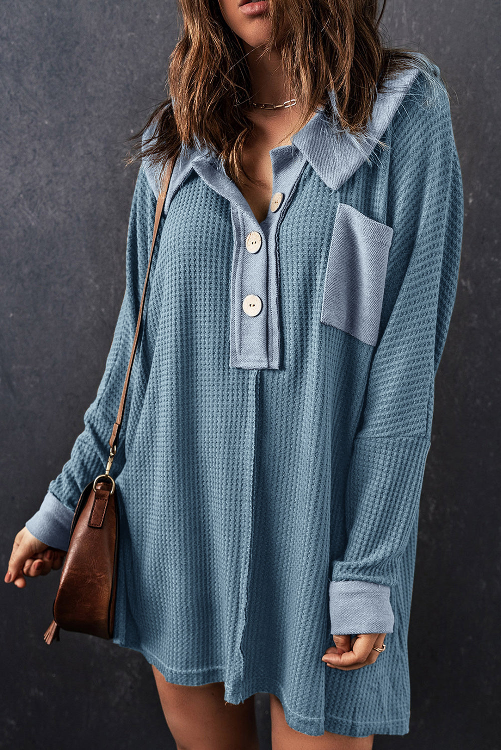 A stylish green waffle knit long sleeve top with buttons, perfect for casual wear and layering.