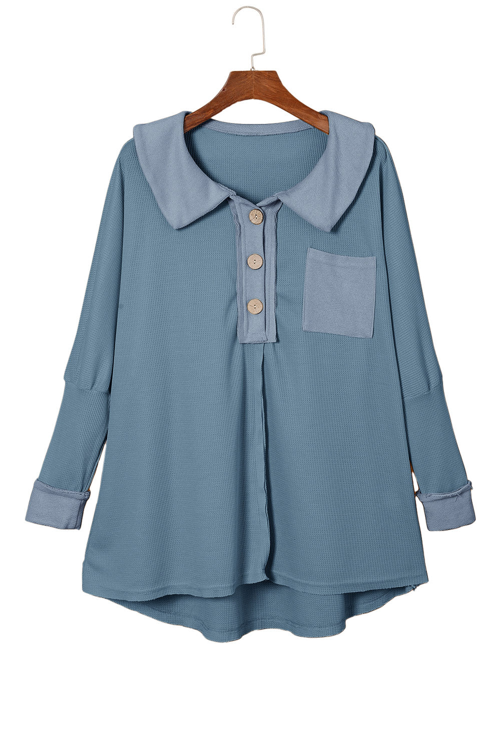 A stylish green waffle knit long sleeve top with buttons, perfect for casual wear and layering.