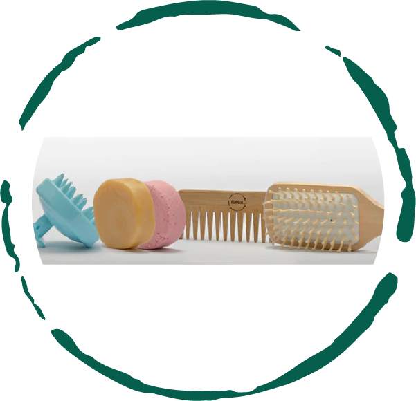 Hair Care Bundle featuring shampoo bar, conditioner bar, bamboo comb, wooden brush, and scalp massager arranged aesthetically.