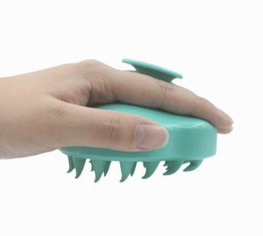 A soft silicone Hair Scalp Massager with ergonomic handle, designed for all hair types and sensitive scalps, promoting relaxation and hair growth.