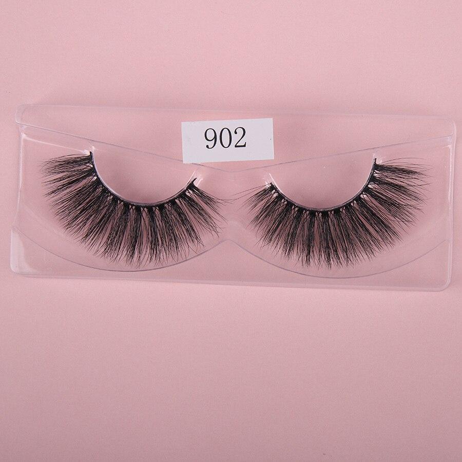 A pair of luxurious HandMade Mink Eyelashes showcasing 3D natural false lashes with a black cotton band, perfect for enhancing eye makeup.