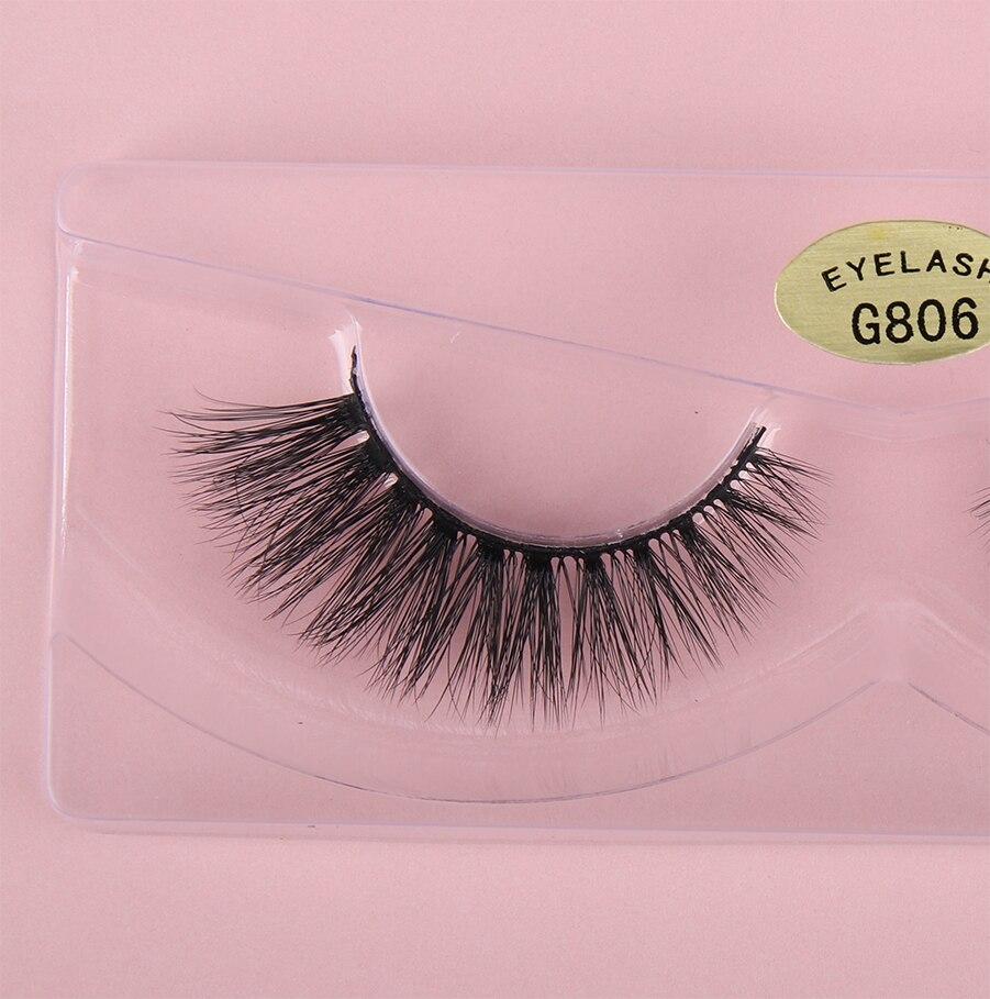 A pair of luxurious HandMade Mink Eyelashes showcasing 3D natural false lashes with a black cotton band, perfect for enhancing eye makeup.