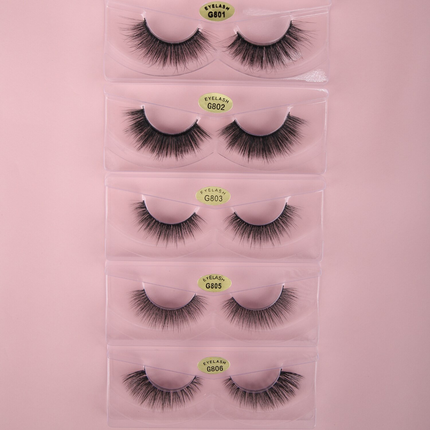 A pair of luxurious HandMade Mink Eyelashes showcasing 3D natural false lashes with a black cotton band, perfect for enhancing eye makeup.