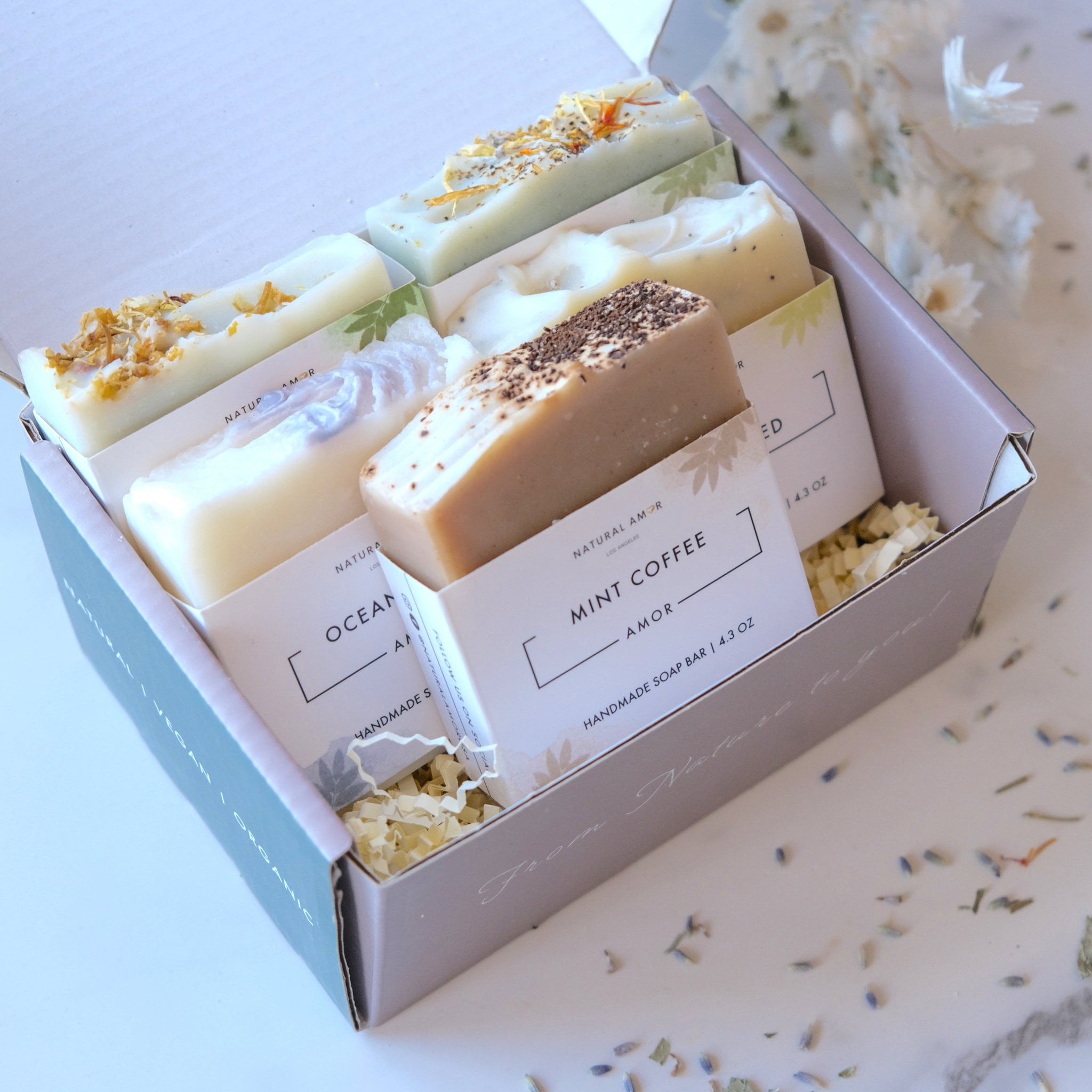 Box of handmade scented soap bars.