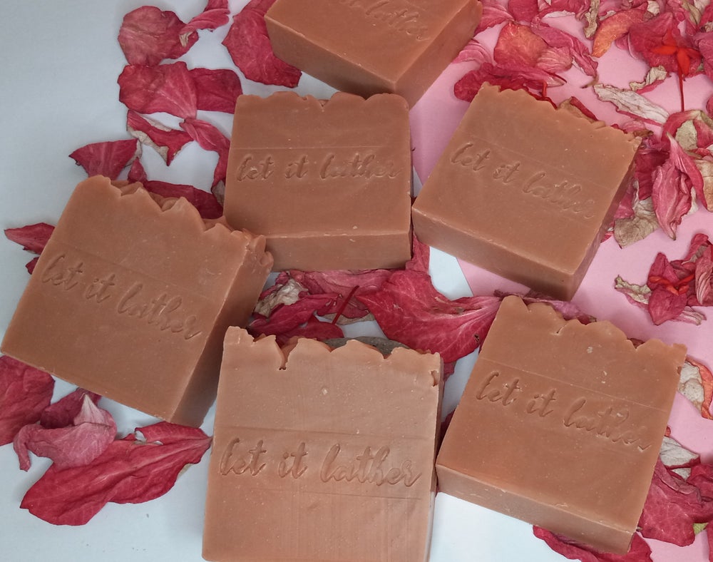 Hibiscus & French Pink Clay Bath Soap with natural ingredients, showcasing its vibrant color and texture.