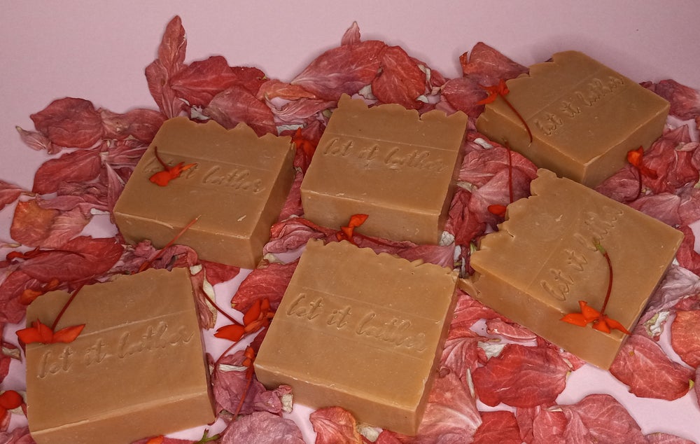 Hibiscus & French Pink Clay Bath Soap with natural ingredients, showcasing its vibrant color and texture.