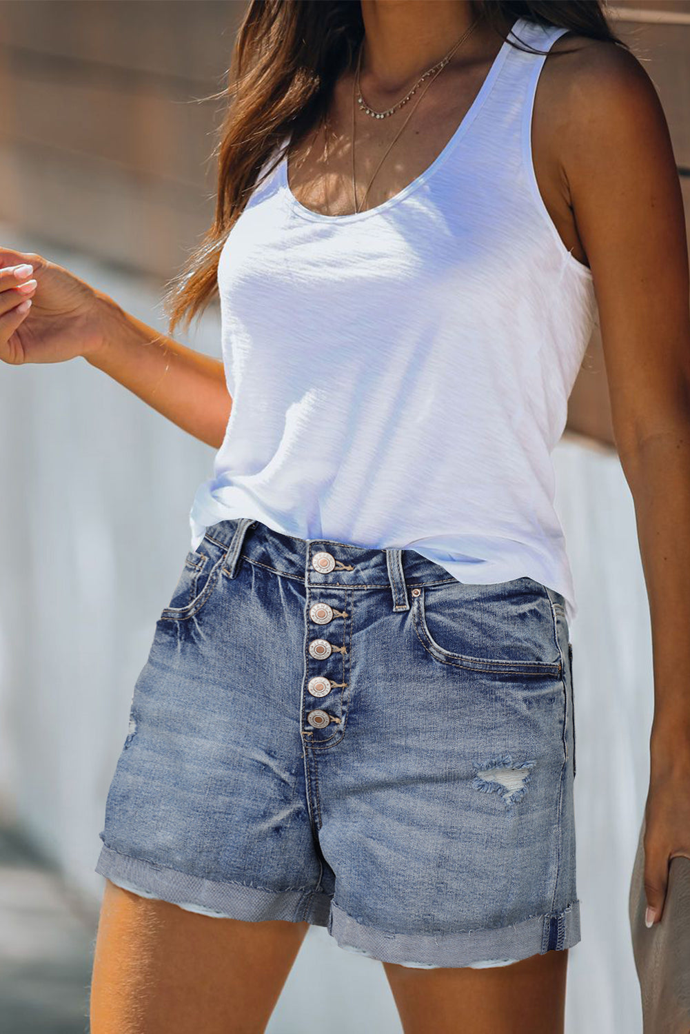 High Rise Button Fly Distressed Denim Shorts featuring a stylish distressed design and button fly closure, perfect for summer outfits.