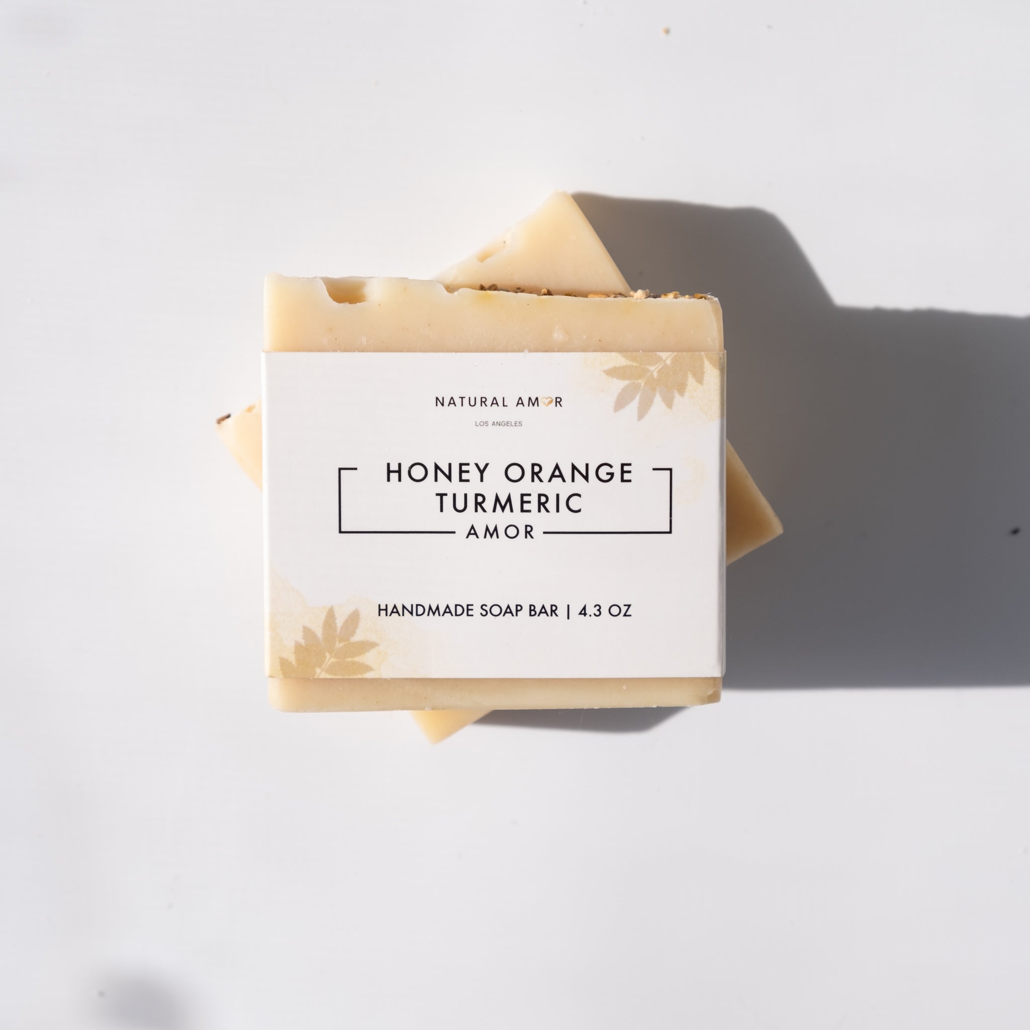 Honey Orange Turmeric Soap Bar with natural ingredients, showcasing its creamy texture and vibrant color.