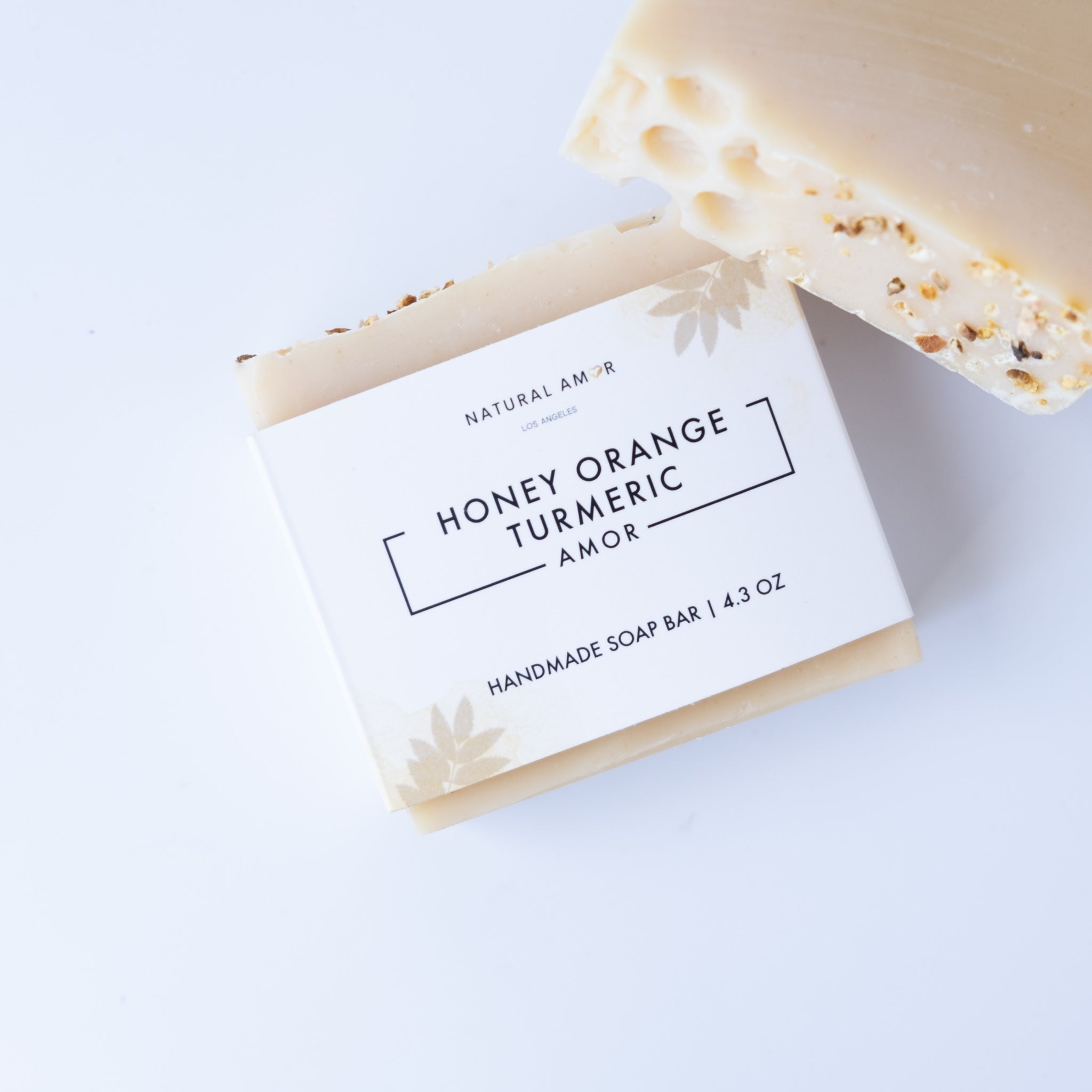 Honey Orange Turmeric Soap Bar with natural ingredients, showcasing its creamy texture and vibrant color.