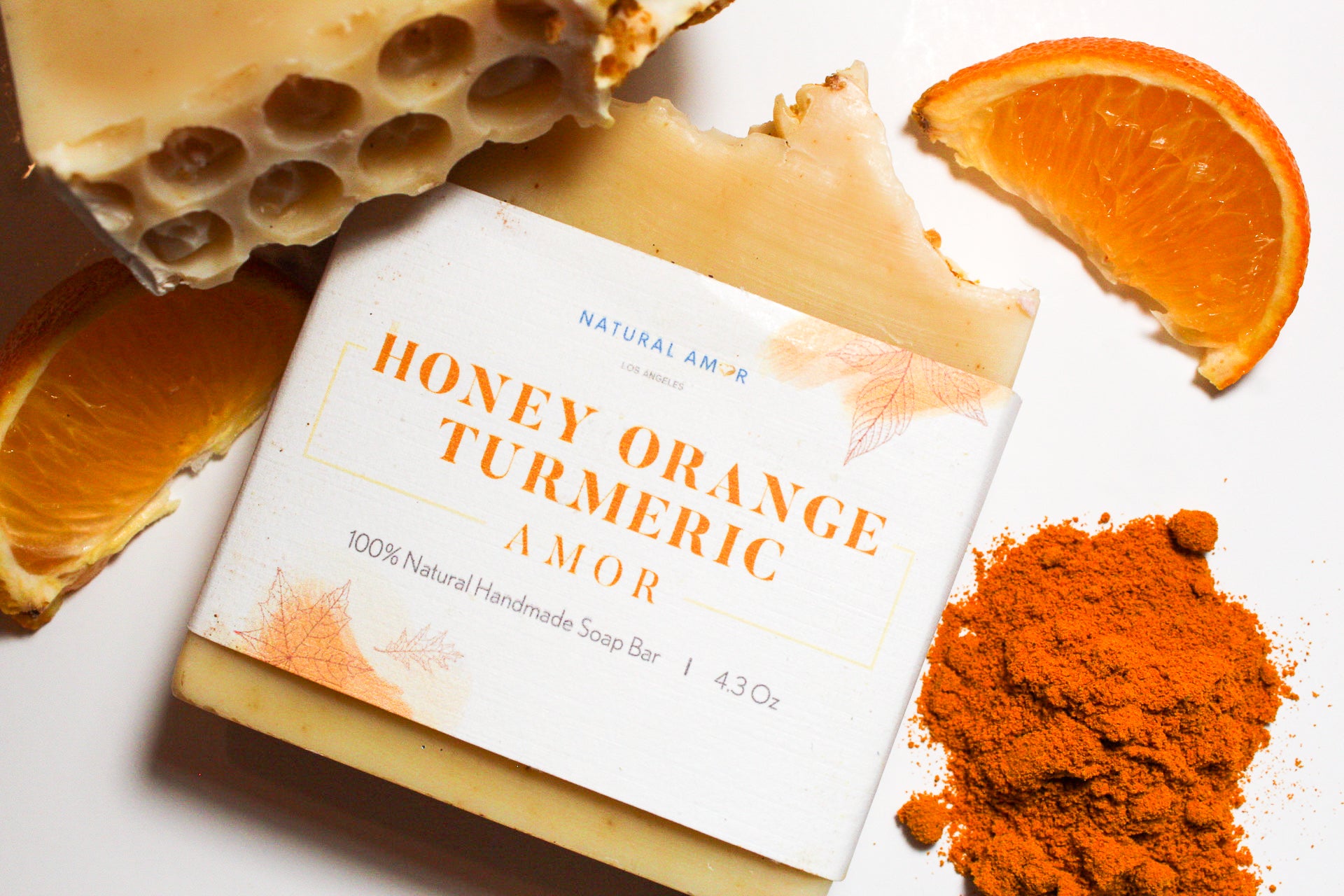 Honey Orange Turmeric Soap Bar with natural ingredients, showcasing its creamy texture and vibrant color.