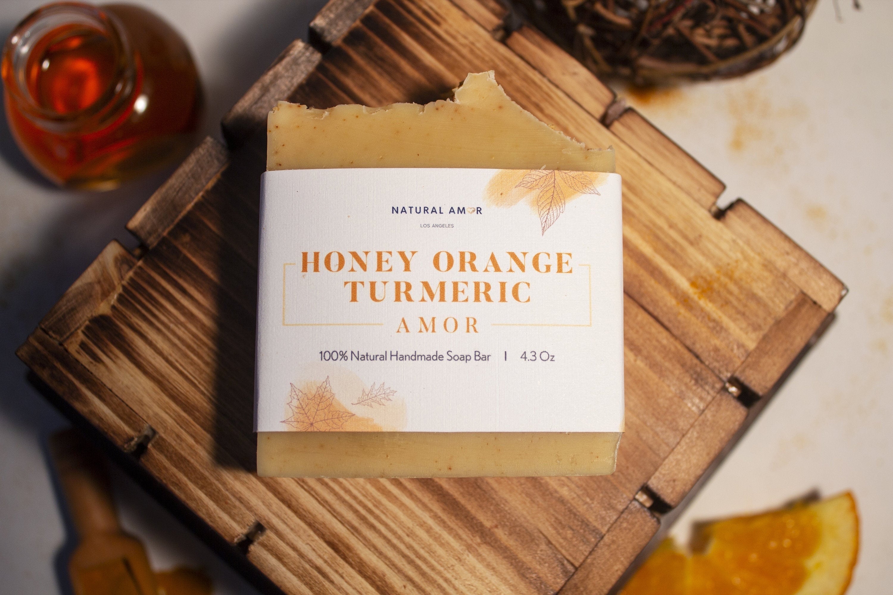 Honey Orange Turmeric Soap Bar with natural ingredients, showcasing its creamy texture and vibrant color.