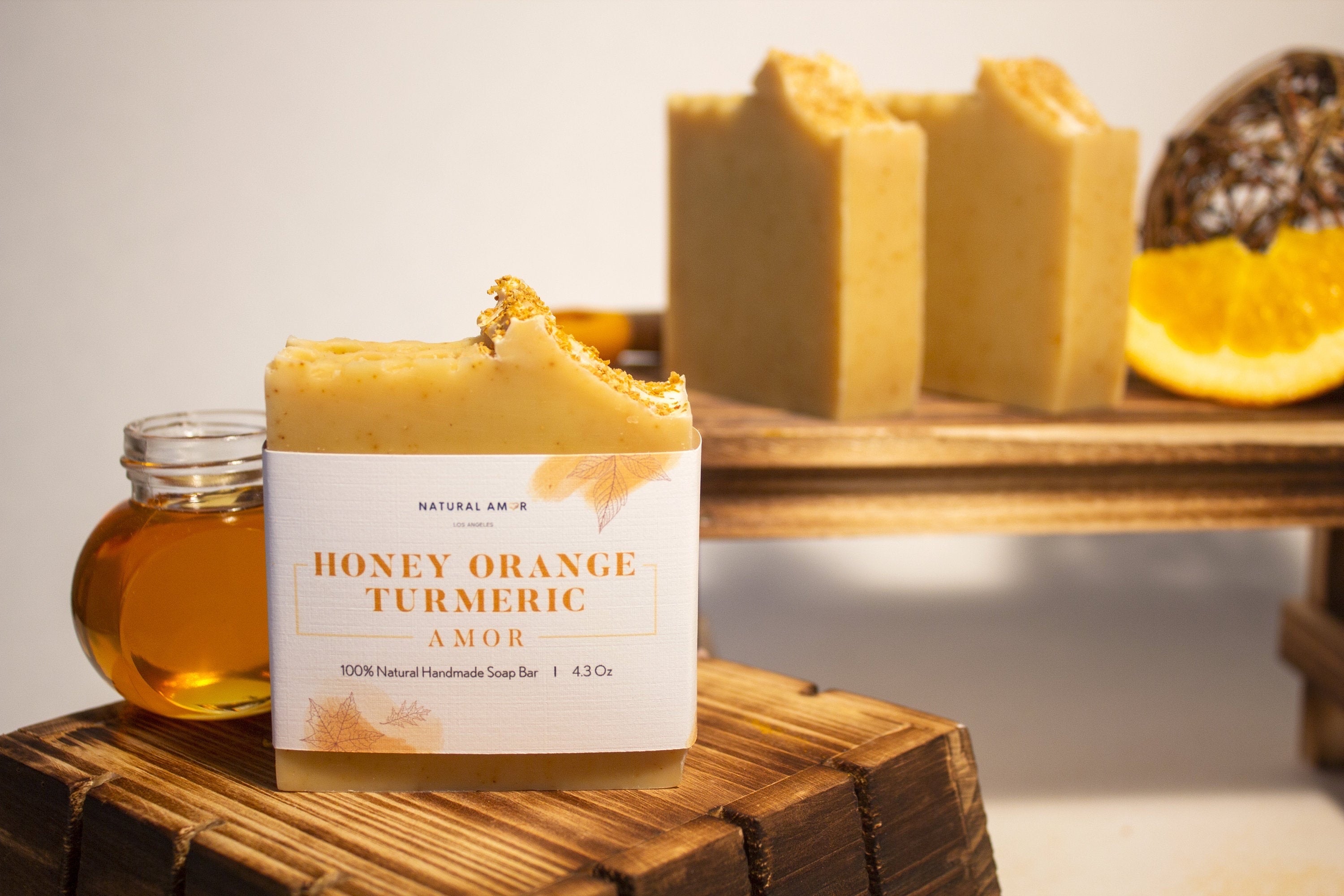 Honey Orange Turmeric Soap Bar with natural ingredients, showcasing its creamy texture and vibrant color.