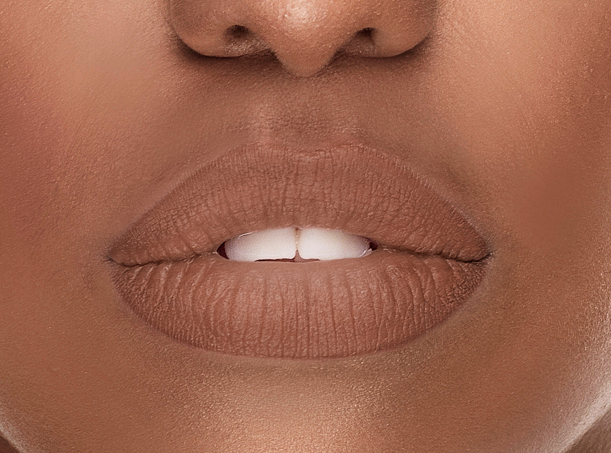 Immortal Silk-Matte Lipstick in Neutral Nude shade, showcasing its elegant packaging and rich color.