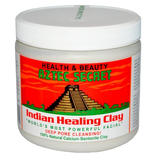 Aztec Secret Indian Healing Clay in a jar with a wooden spoon, showcasing its fine powder texture.