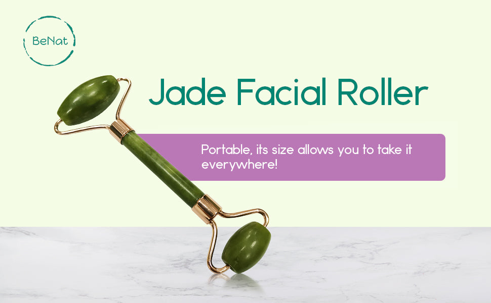 A jade facial roller resting on a soft surface, showcasing its smooth jade stone and elegant design, perfect for facial massages.