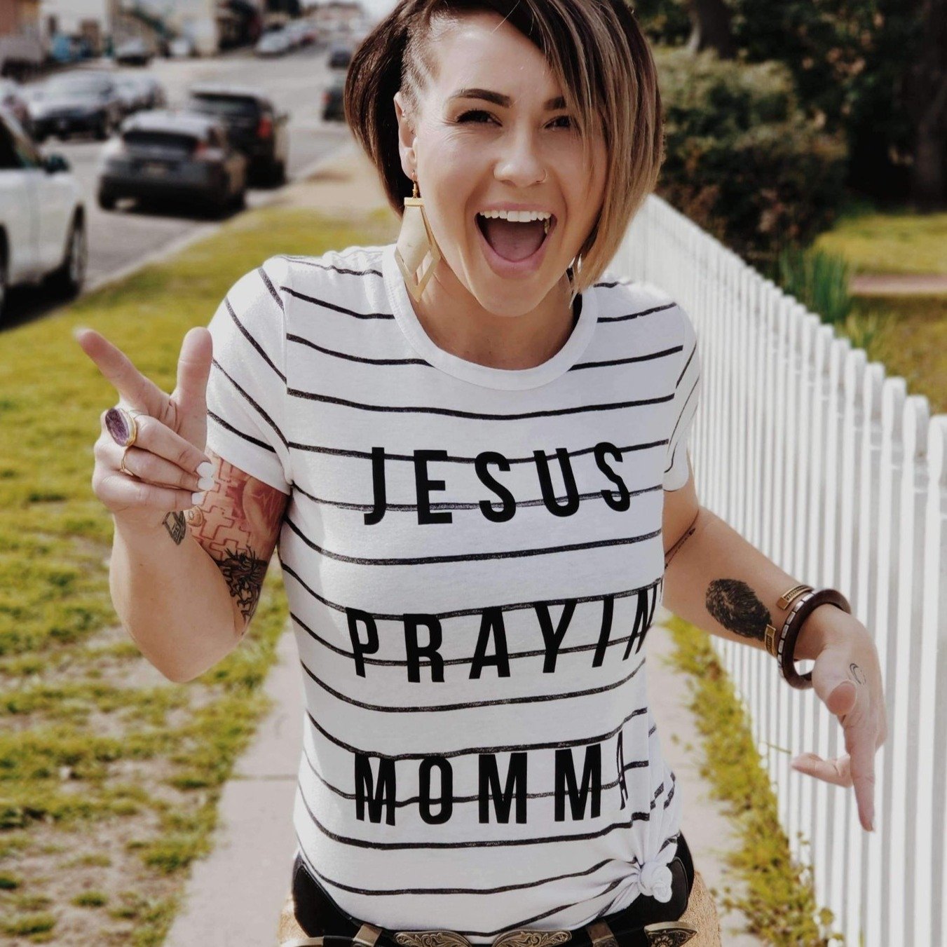 Jesus Prayin' Momma Striped Tee featuring a trendy striped design, made from a soft poly/cotton blend, with an adorable shoulder tag.