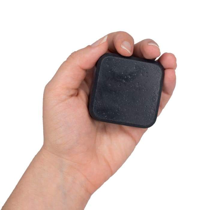 Just Chill Activated Charcoal Facial Soap bar with natural ingredients, showcasing its rich texture and essential oils.