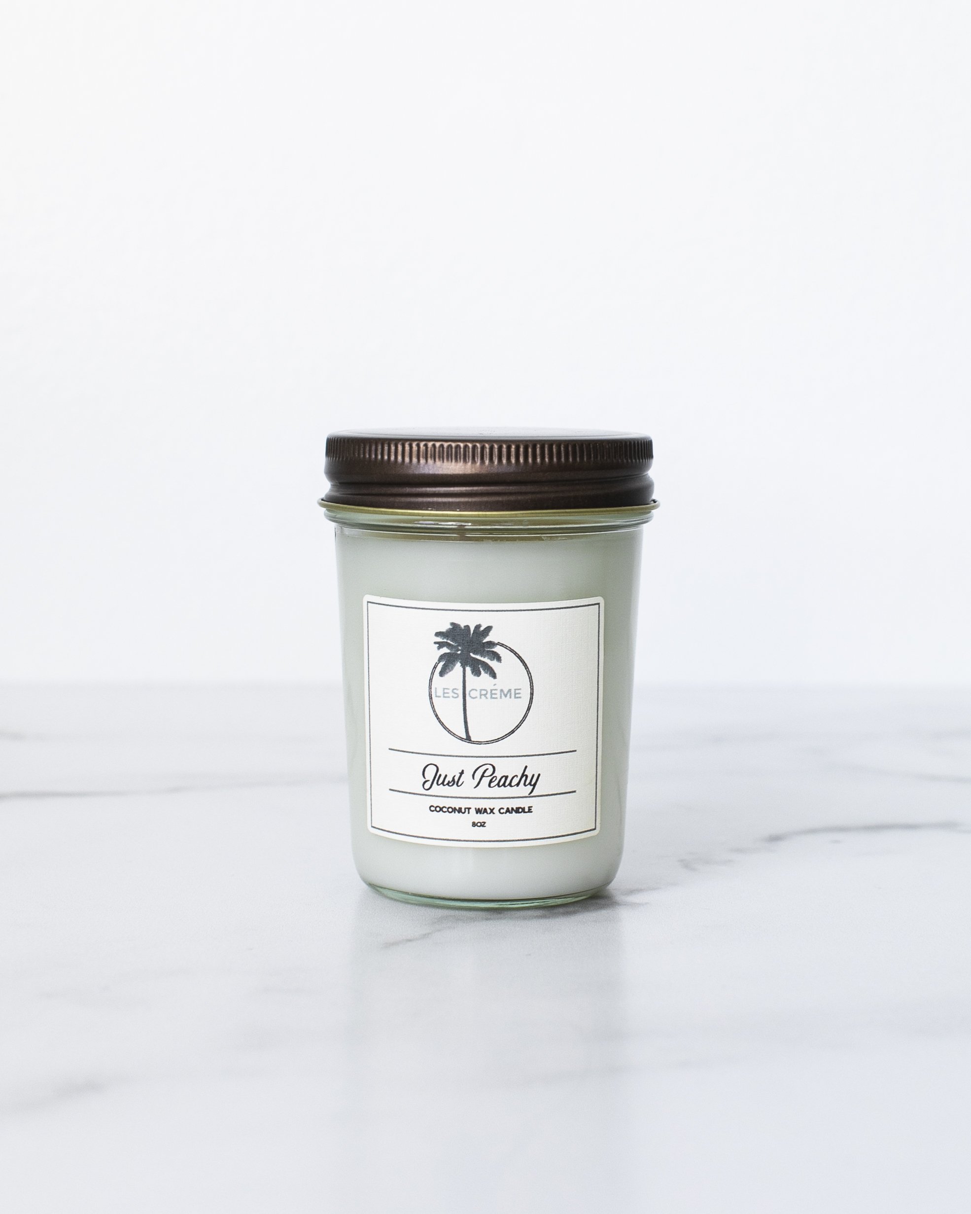 Just Peachy Scent Coconut Wax Candle with peach and vanilla fragrance, featuring a clean design and cotton wick.