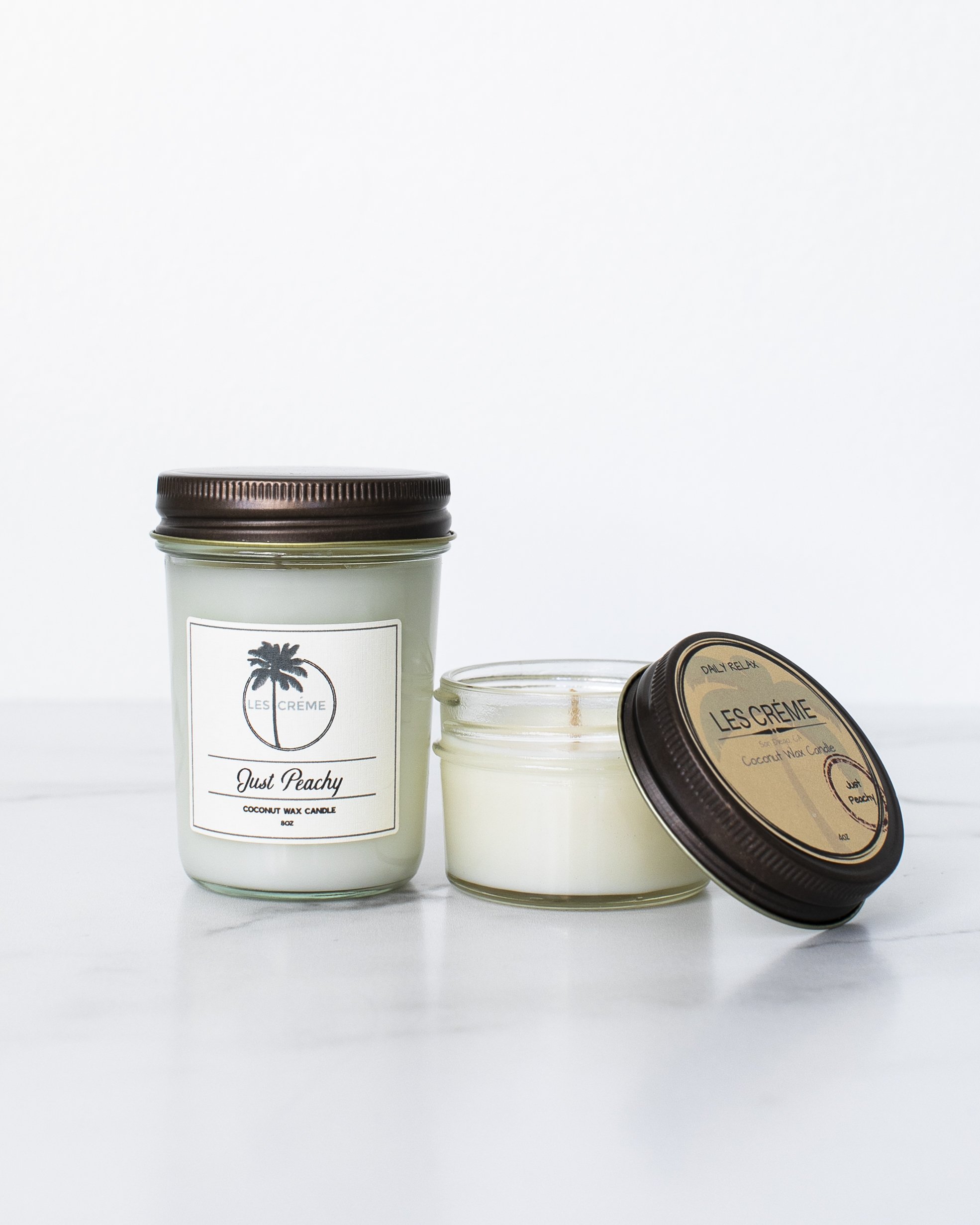 Just Peachy Scent Coconut Wax Candle with peach and vanilla fragrance, featuring a clean design and cotton wick.