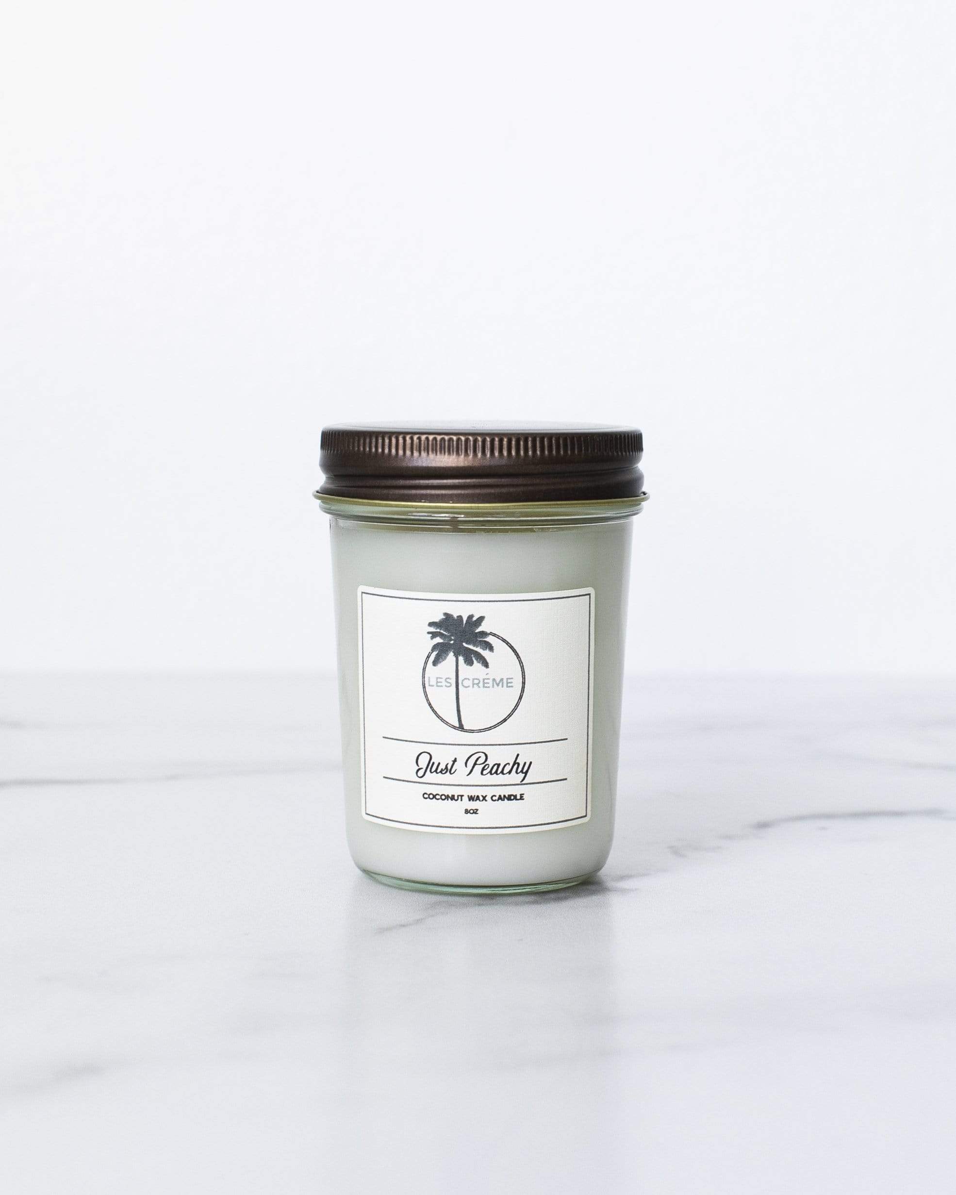 Just Peachy Scent Coconut Wax Candle with peach and vanilla fragrance, featuring a clean design and cotton wick.