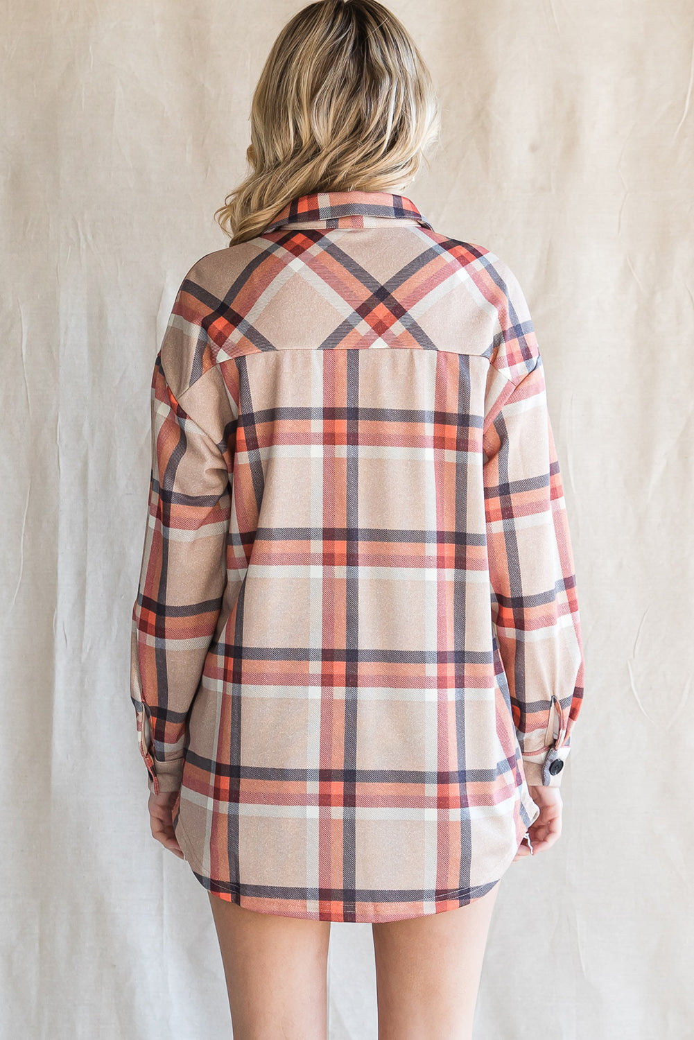 Khaki oversized plaid shacket with button closure and chest pockets, perfect for layering.