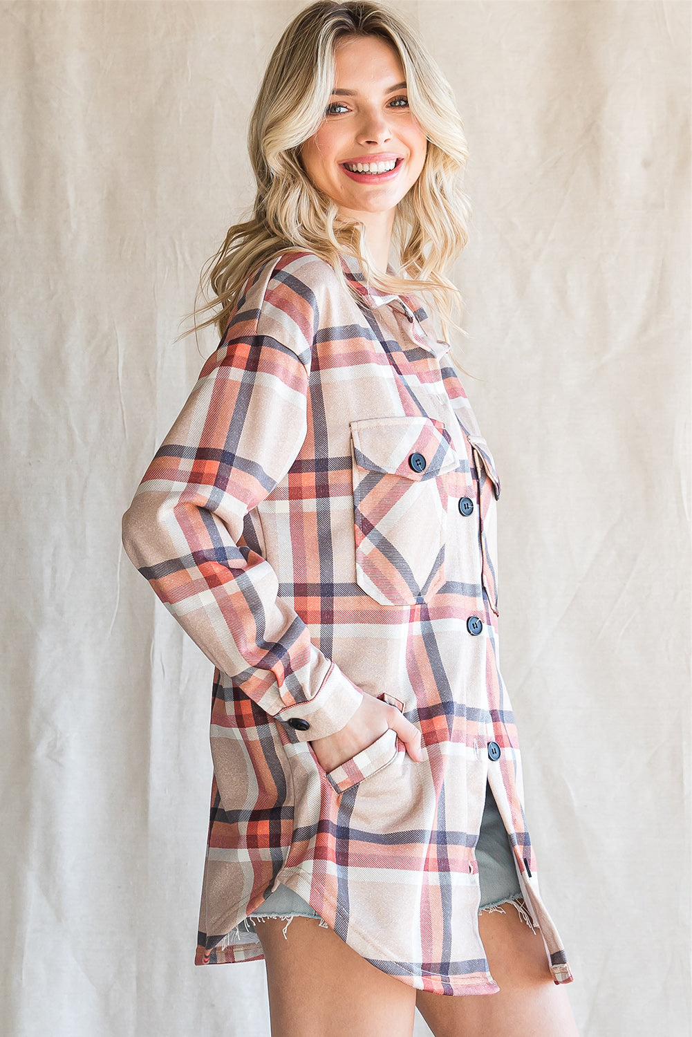 Khaki oversized plaid shacket with button closure and chest pockets, perfect for layering.