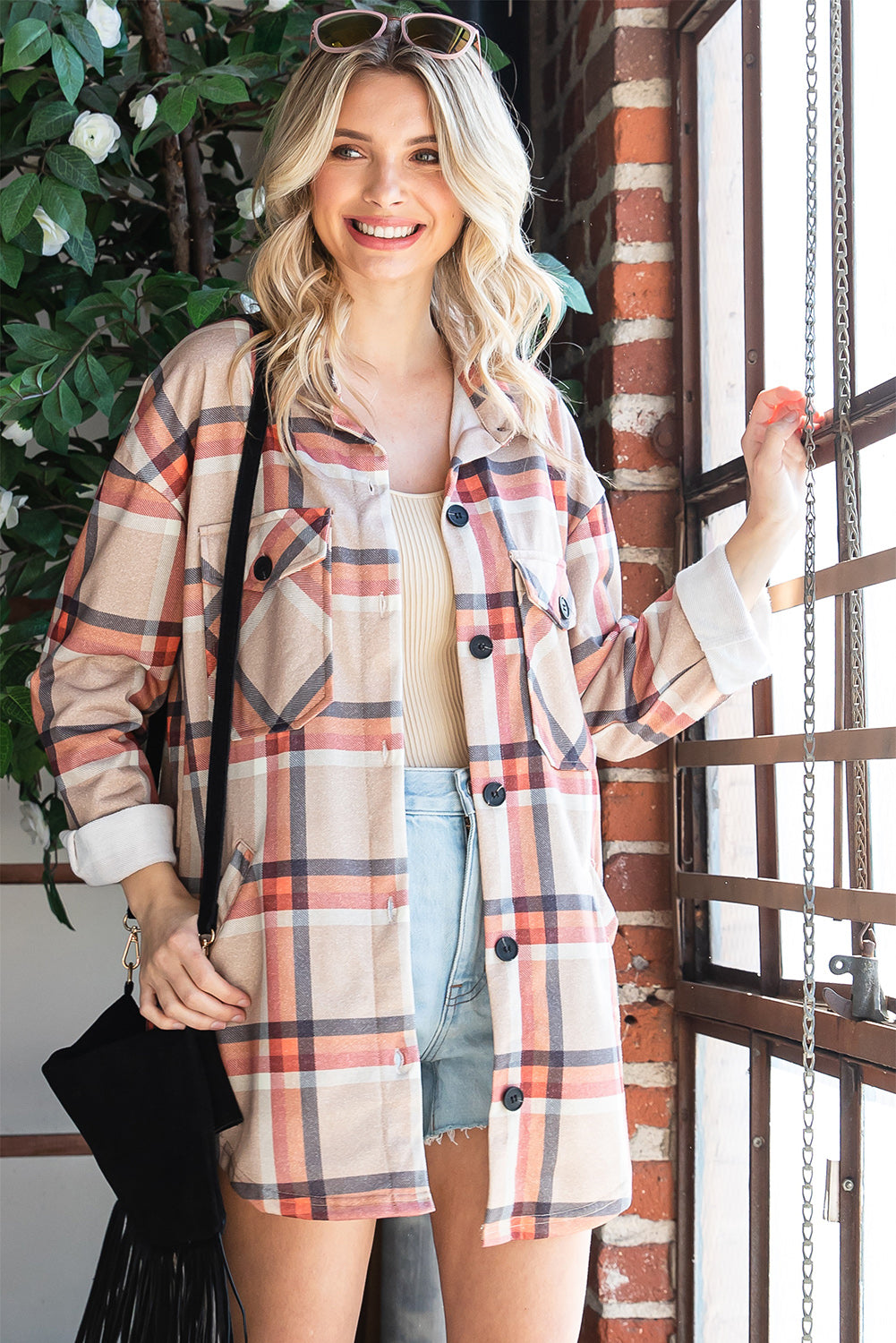 Khaki oversized plaid shacket with button closure and chest pockets, perfect for layering.