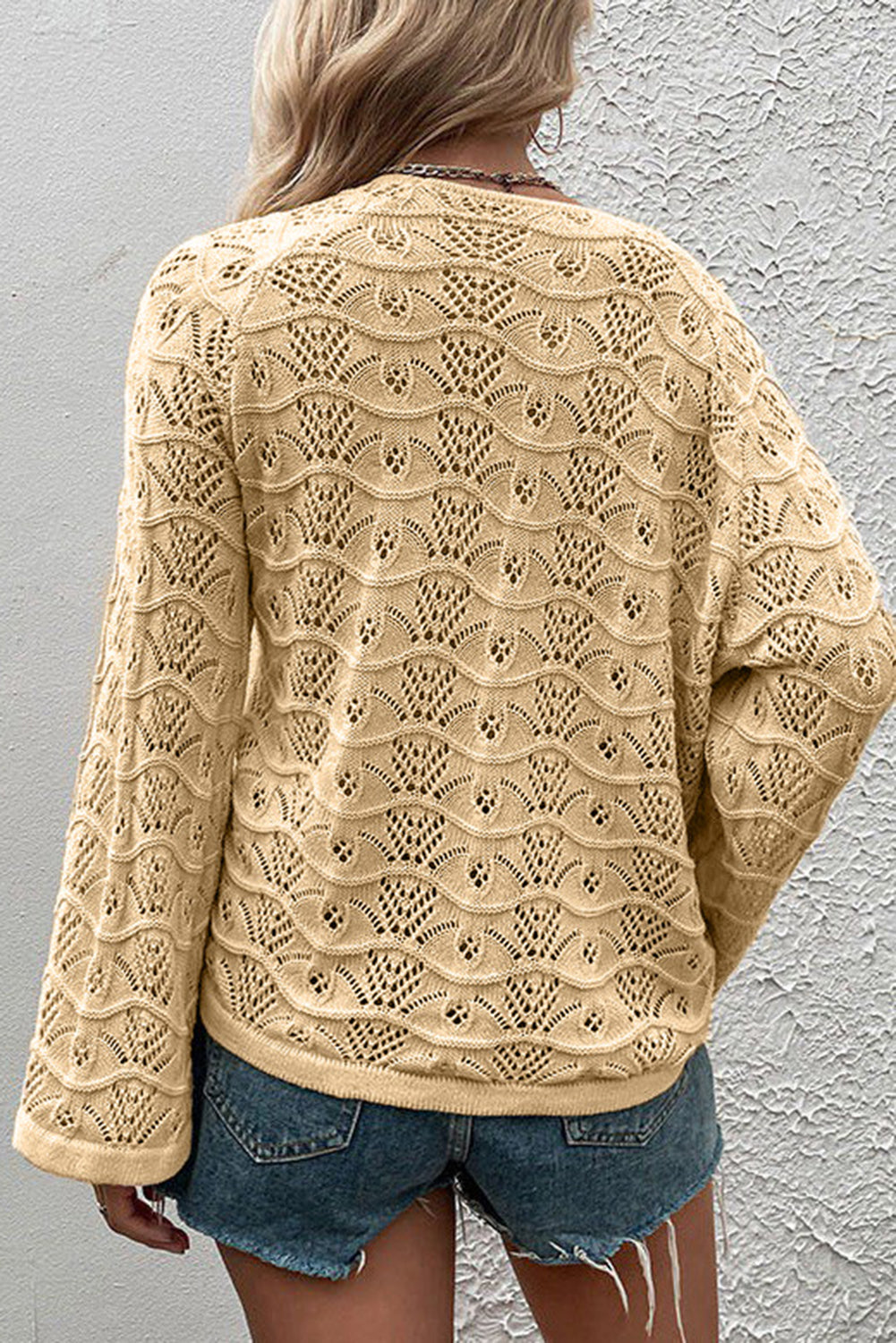 Khaki Hollowed Knit Asymmetric Drawstring Sweater showcasing a trendy hollowed knit design with drawstring accents and an asymmetric neckline.