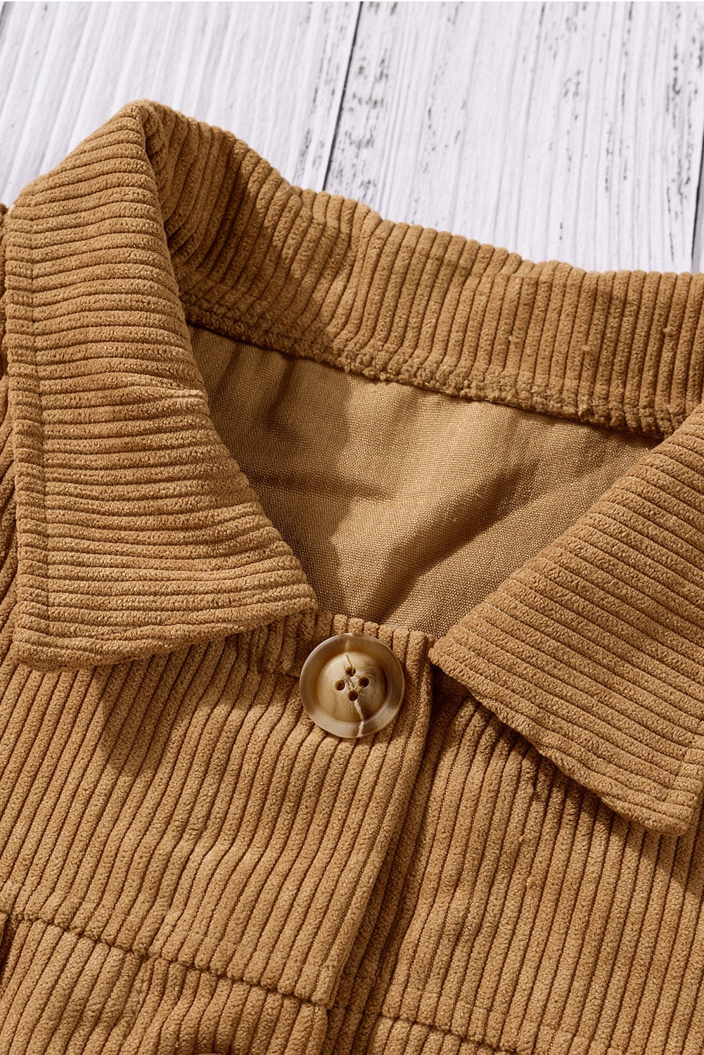 Khaki ribbed corduroy long sleeve jacket featuring a turn-down collar and multiple pockets, perfect for autumn wear.