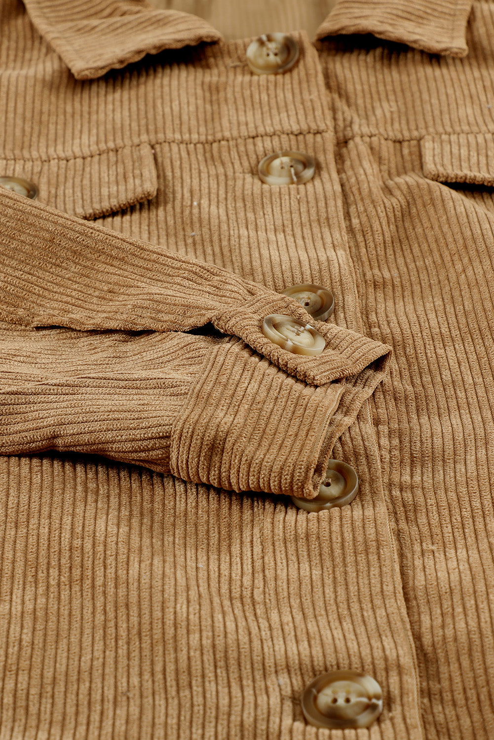 Khaki ribbed corduroy long sleeve jacket featuring a turn-down collar and multiple pockets, perfect for autumn wear.