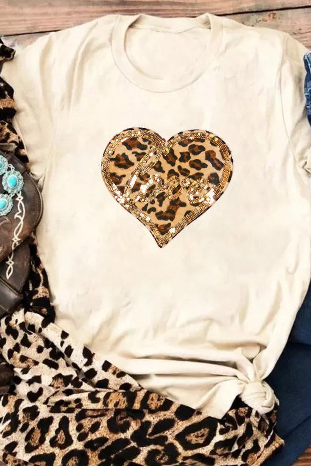 Khaki T-shirt featuring a sequined leopard print heart design, perfect for Valentine's Day fashion.