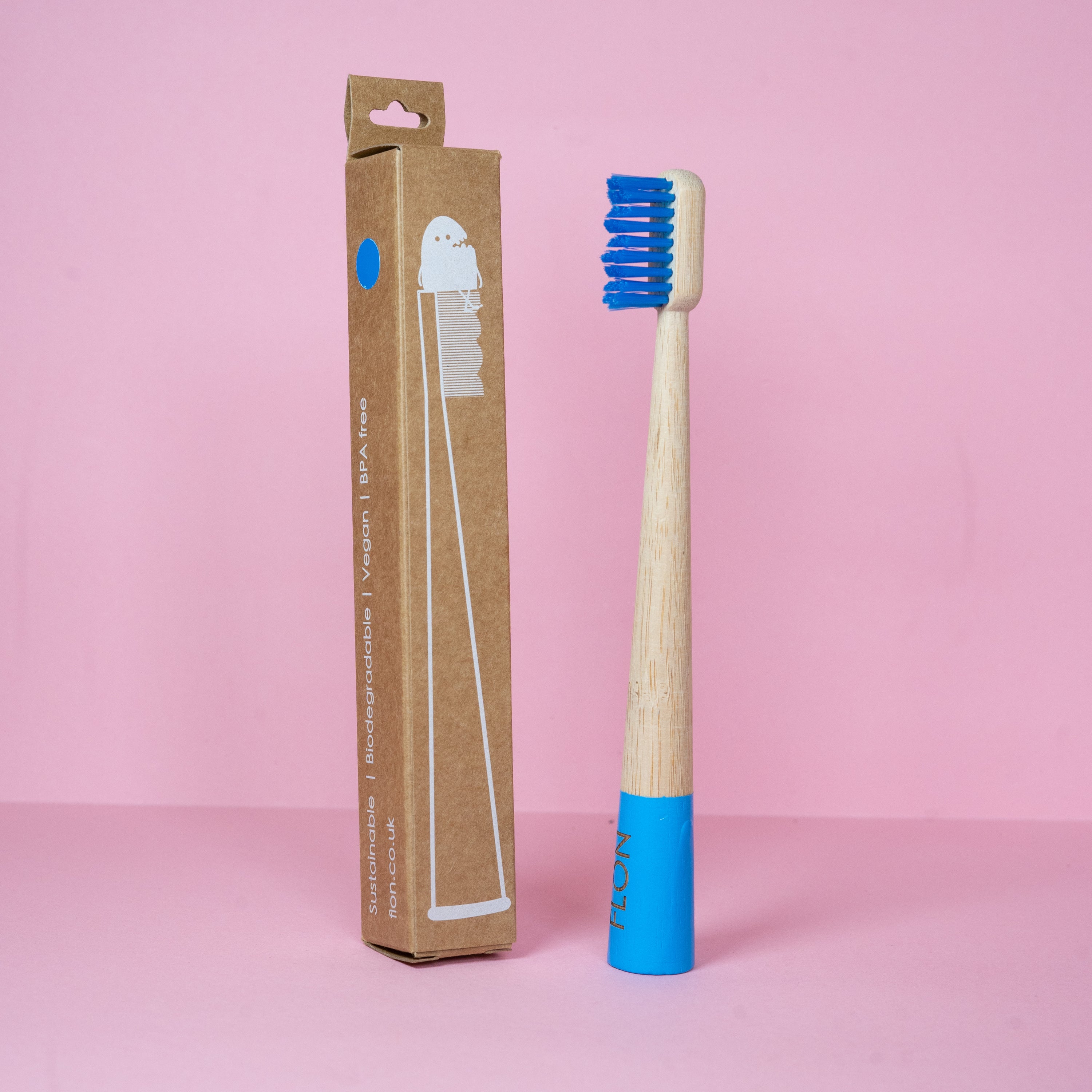 A set of colorful Kids Bamboo Toothbrushes with biodegradable bamboo handles and soft bristles, displayed in eco-friendly packaging.