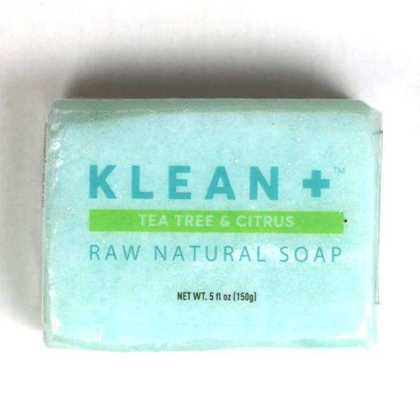 Klean + Raw Natural Soap bar with tea tree and citrus scent, showcasing its natural ingredients and eco-friendly packaging.