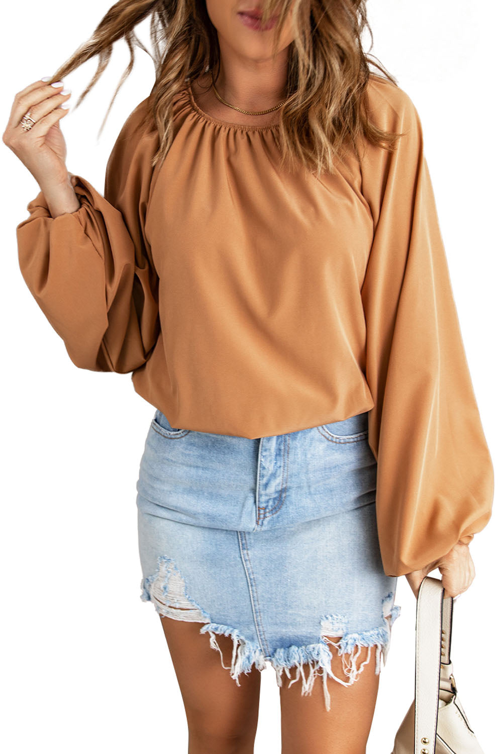 A stylish Lantern Sleeve Loose Blouse featuring a relaxed fit, round neck, and bubble sleeves, perfect for modern women.