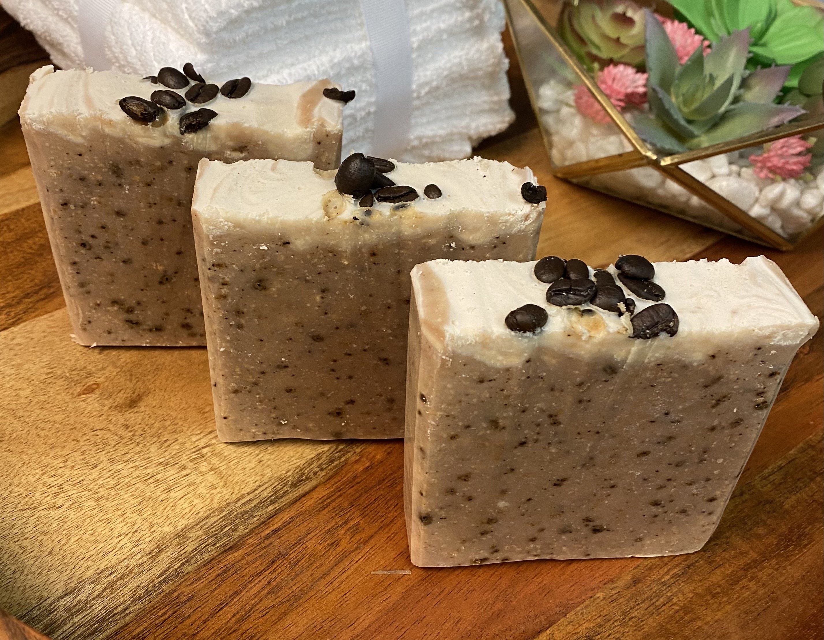 Large Goats Milk Coffee Scrub Soap bar with coffee grounds and oatmeal, showcasing its creamy texture and caramel color.