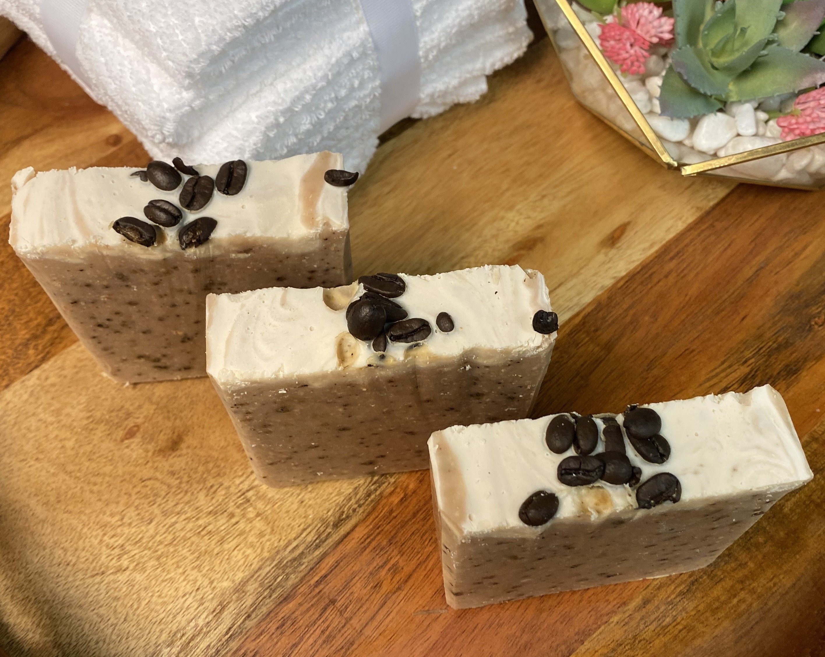 Large Goats Milk Coffee Scrub Soap bar with coffee grounds and oatmeal, showcasing its creamy texture and caramel color.