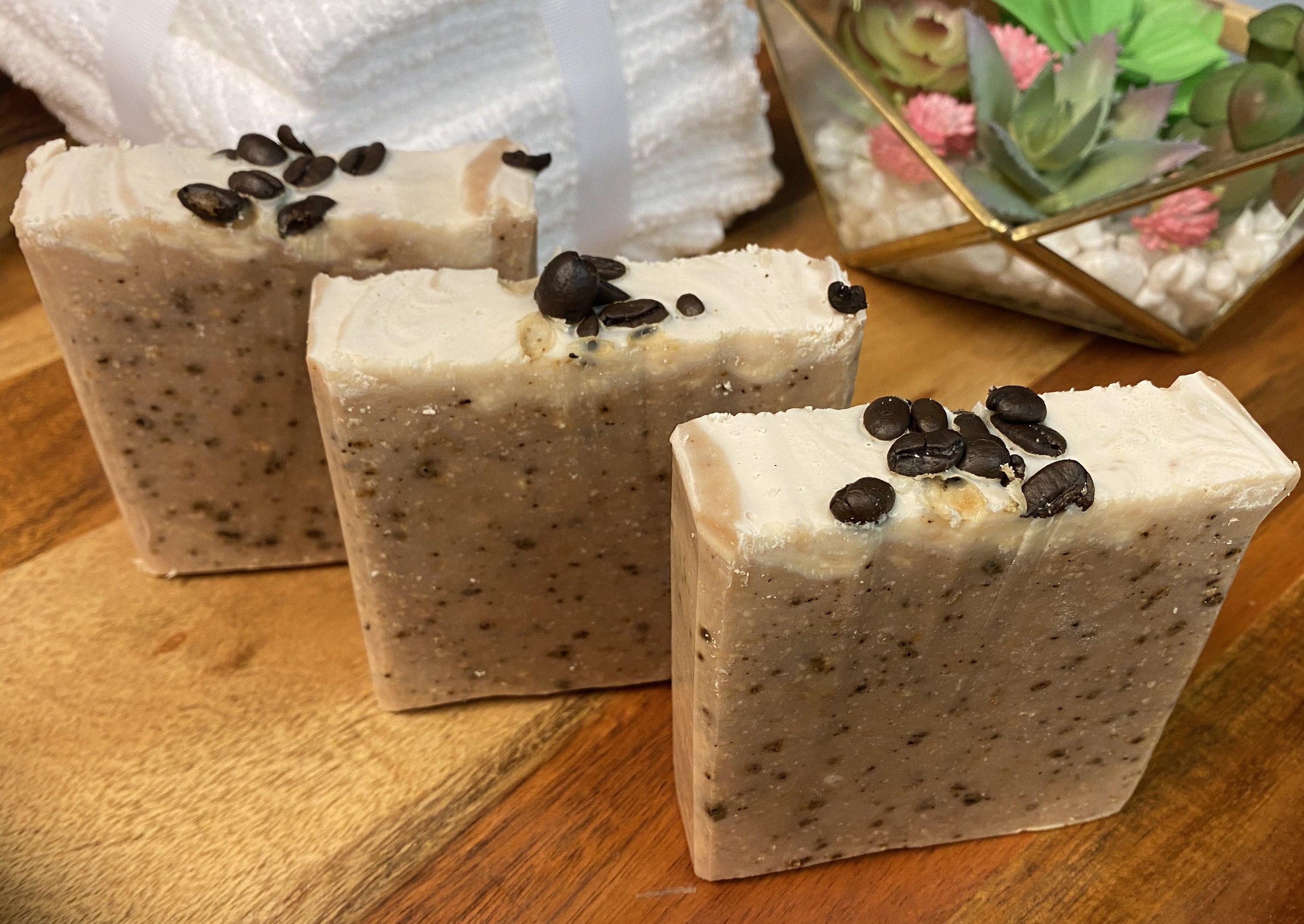 Large Goats Milk Coffee Scrub Soap bar with coffee grounds and oatmeal, showcasing its creamy texture and caramel color.