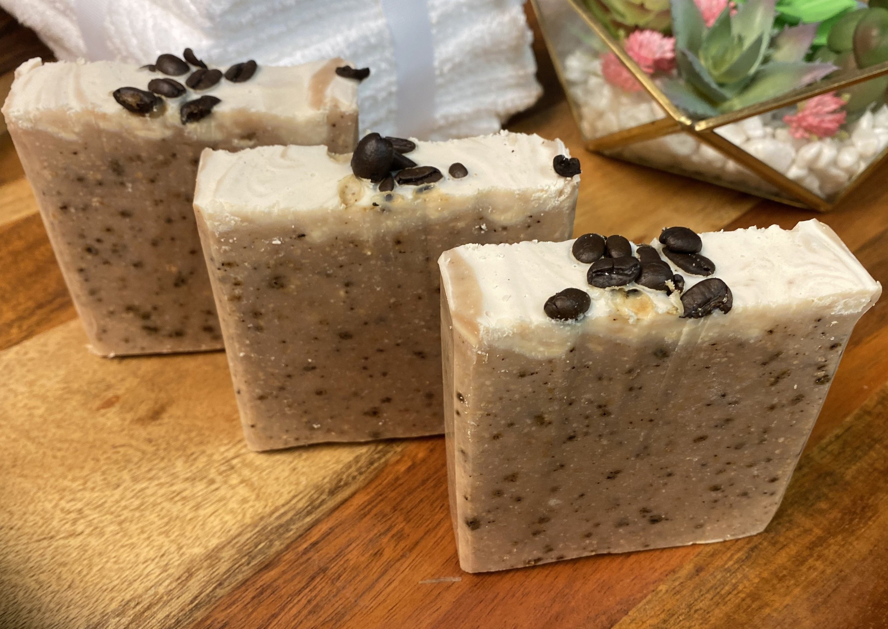 Large Goats Milk Coffee Scrub Soap bar with coffee grounds and oatmeal, showcasing its creamy texture and caramel color.