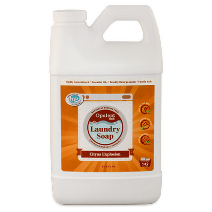 A bottle of Citrus Explosion Laundry Soap with a vibrant citrus design, showcasing its natural ingredients and concentrated formula.