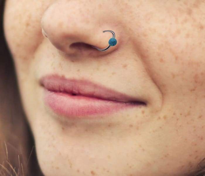 Lava Clip-On Nose Ring in blue, showcasing its unique lava stone texture and clip-on design for easy wear.