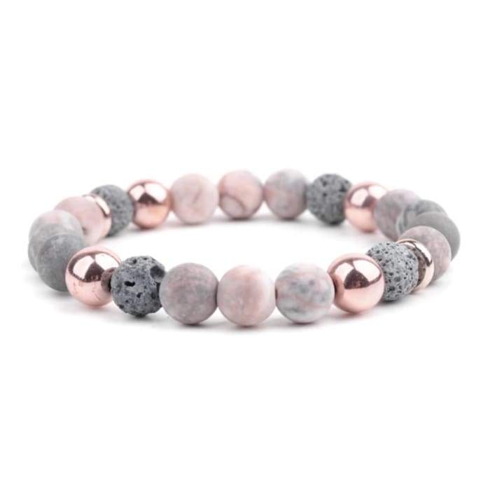 Lava Stone Essential Oil Bracelet featuring Agate Rose Gold accents, showcasing its stylish design and natural lava stones.