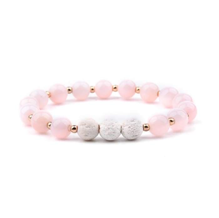 Lava Stone Essential Oil Bracelet in pink and white, showcasing its natural stones and stylish design.